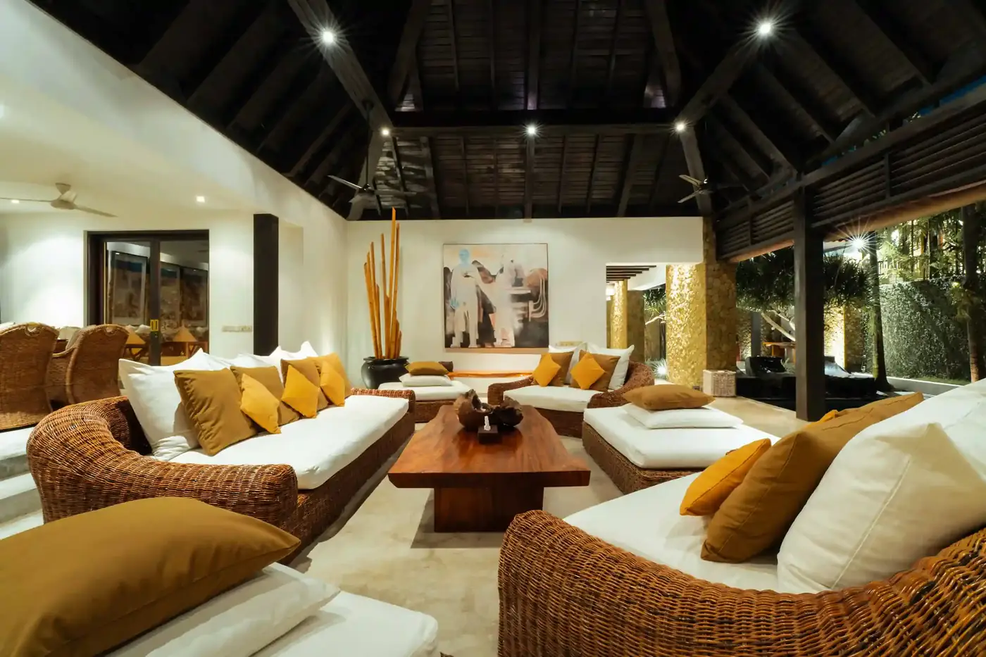 Open-air living room with rattan sofas at a Canggu villa