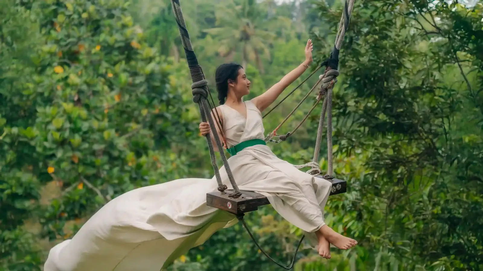 Woman on a jungle swing above the Ubud forest
