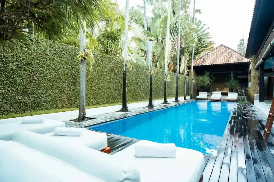 Long private pool with daybeds at a Canggu villa